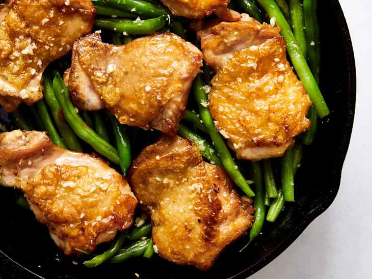 Life-Changing Butter Chicken Thighs with green beans in skillet