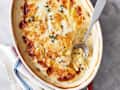 Dauphinoise potatoes in red casserole dish