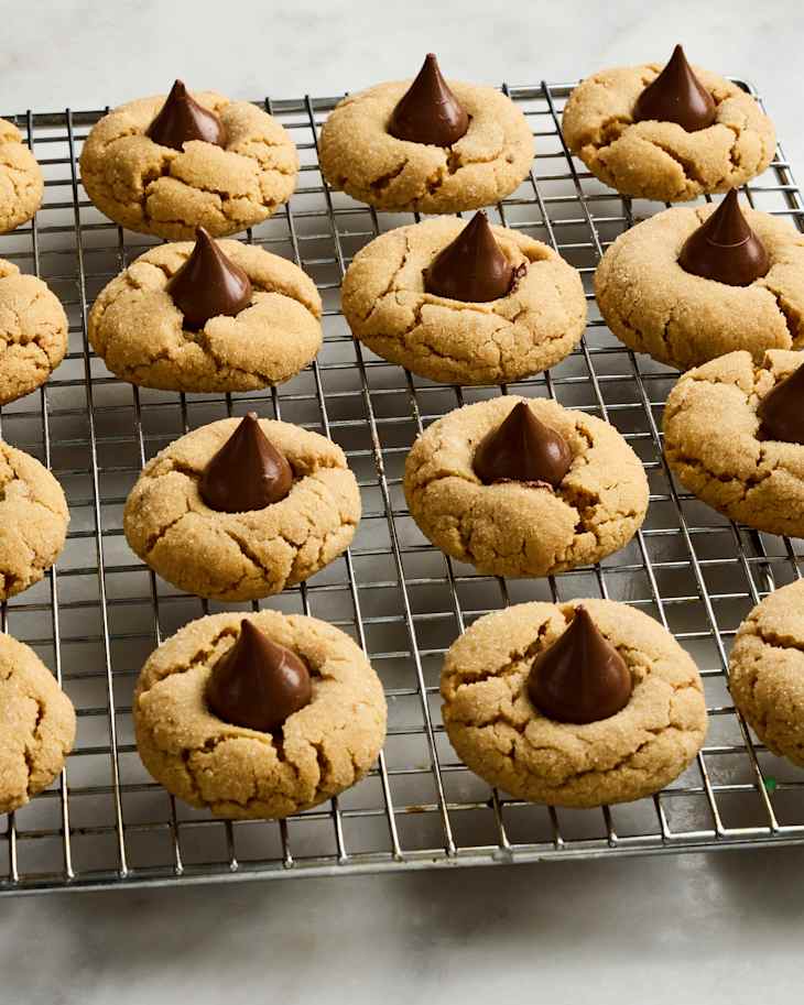 angled shot of peanut butter blossoms on a cooling rack