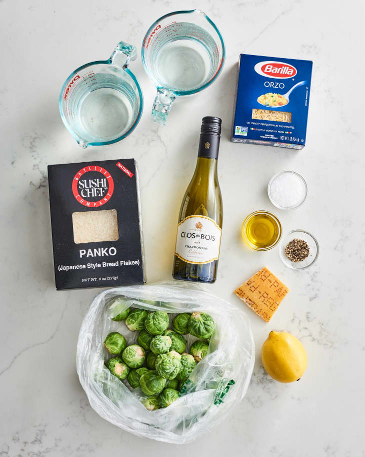 Ingredients for One-Pot Parmesan Brussels Sprouts Orzo, including orzo, Brussels sprouts, panko, wine, and lemon.