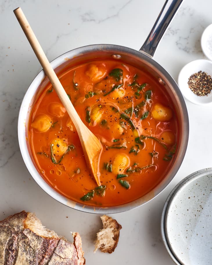 Trader Joe's tomato soup gnocchi with spinach in a pot
