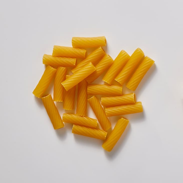 Rigatoni on a white surface