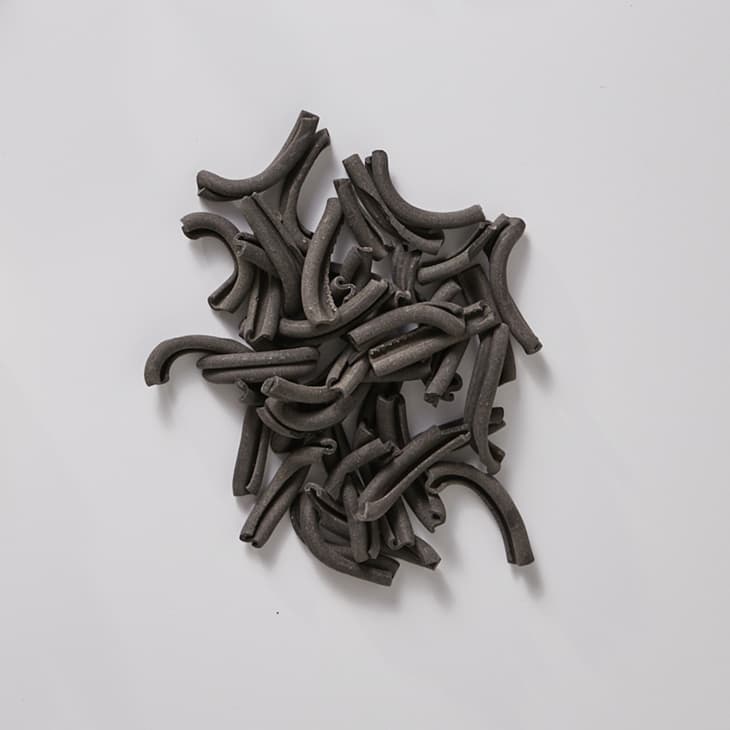 Strozzapreti on a white surface.