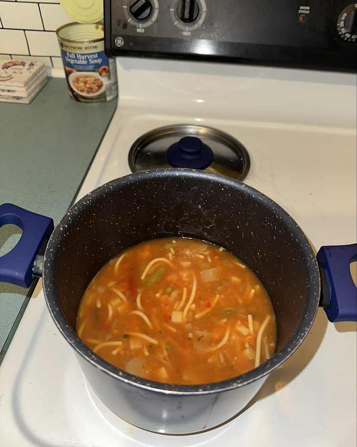 Fall harvest soup in pot on stovetop.