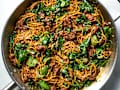 overhead shot of sesame noodles with ground beef and spinach