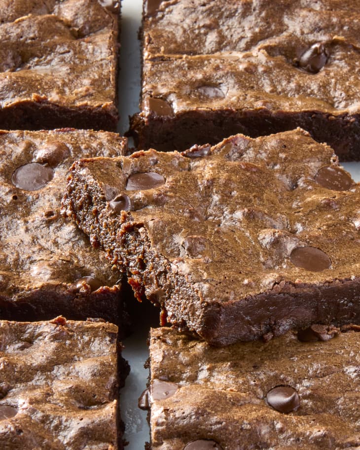 overhead shot of brownies cut into squares on a marble surface