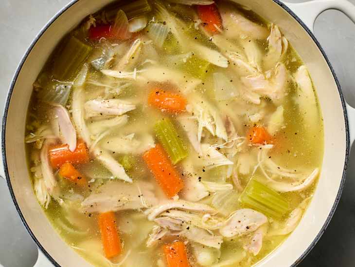 overhead shot of chicken soup in a pot