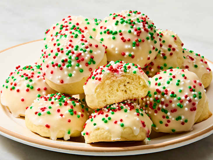 angled shot of a plate full of italian christmas cookies