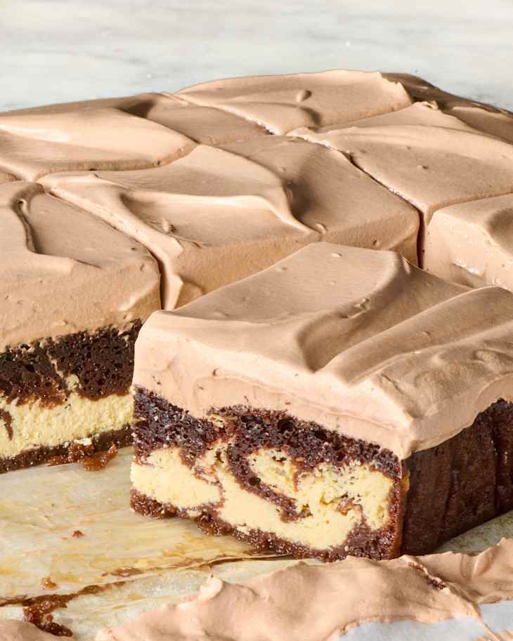 Italian love cake cut up into slices on a piece of parchment paper