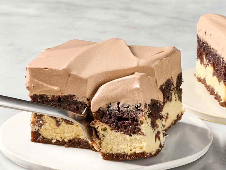 a slice of Italian love cake on a plate with a bite taken out