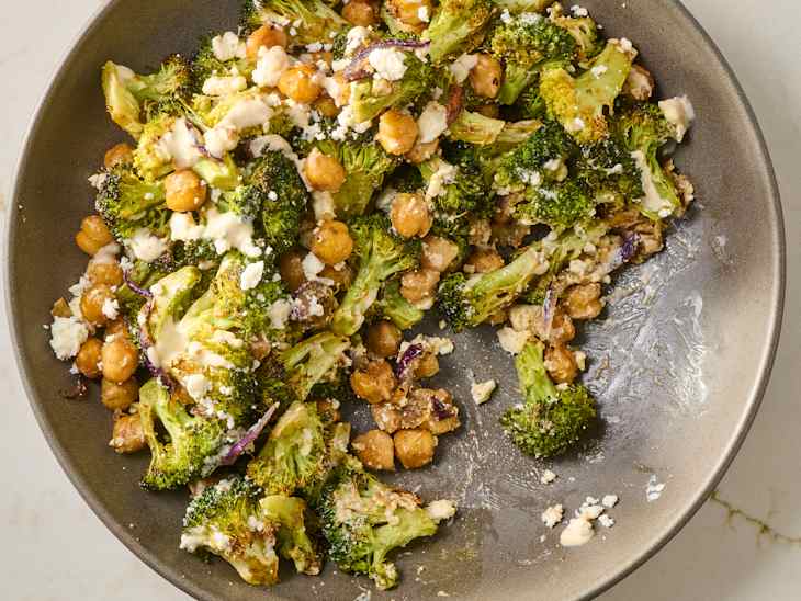 overhead shot of roasted broccoli and chickpea salad in a grey bowl