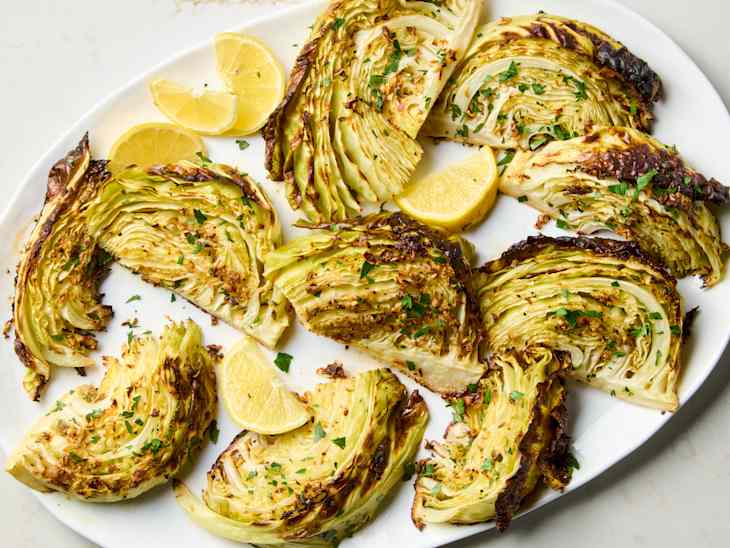 Roasted cabbage wedges on a platter