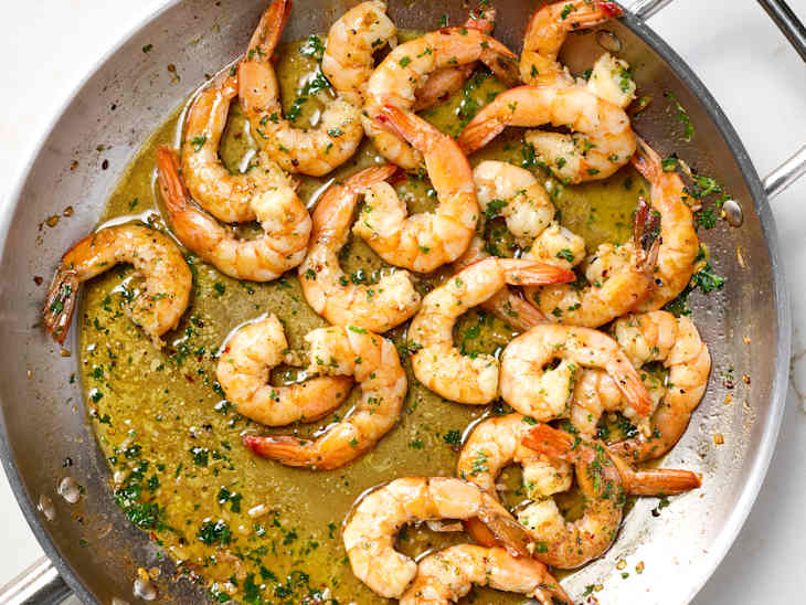 overhead shot of shrimps being cooked in a pan