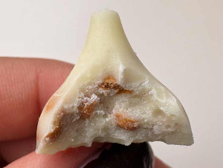 Bite taken out of Snickerdoodle Hershey's kisses.